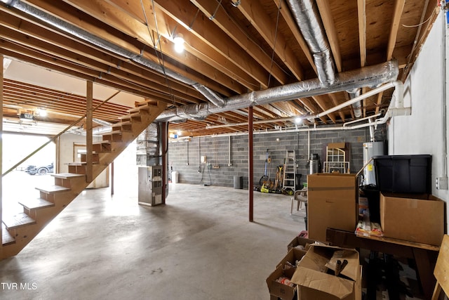 2361 Old Stage Rd, Afton, TN 37616 - basement featuring stairway, water heater, heating unit, and concrete block wall