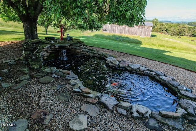 2361 Old Stage Rd, Afton, TN 37616 - view of green lawn with a small pond