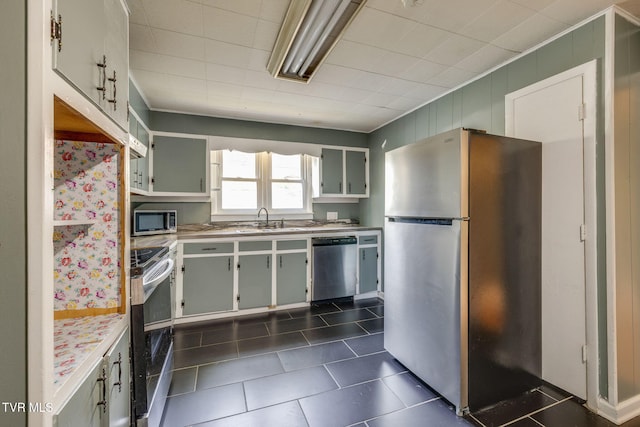 905 Kentucky Ave, Bristol, TN 37620 - kitchen featuring appliances with stainless steel finishes, light countertops, dark tile patterned flooring, and open shelves
