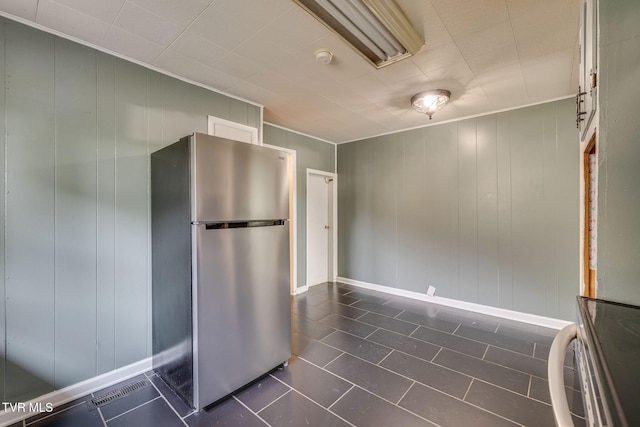 905 Kentucky Ave, Bristol, TN 37620 - kitchen featuring freestanding refrigerator, dark tile patterned flooring, and range