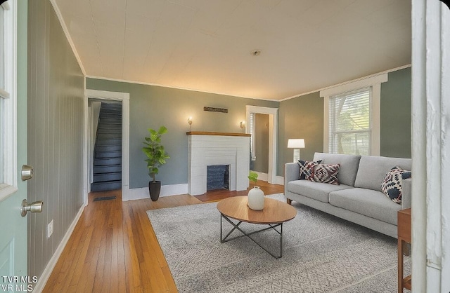 905 Kentucky Ave, Bristol, TN 37620 - living area featuring hardwood / wood-style flooring, ornamental molding, and a brick fireplace