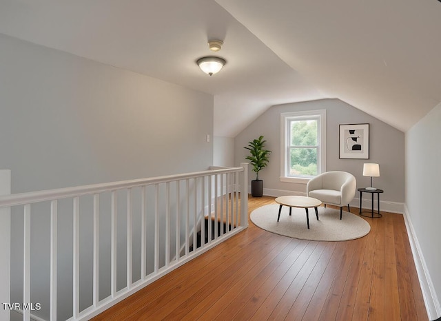 905 Kentucky Ave, Bristol, TN 37620 - sitting room with wood-type flooring, lofted ceiling, and an upstairs landing