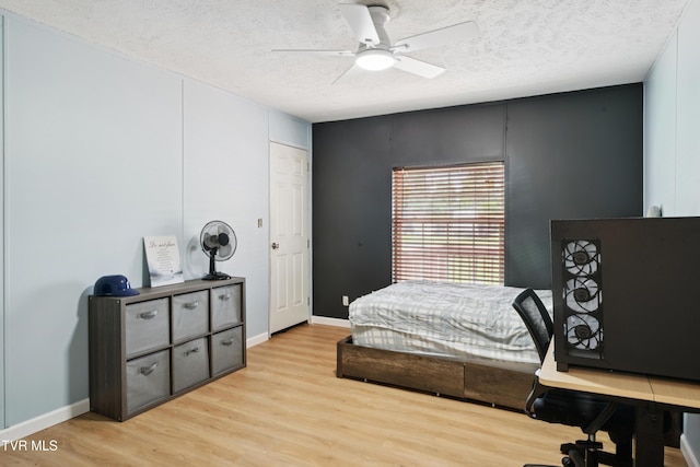 364 Berry Ridge Rd, Jonesborough, TN 37659 - bedroom with light wood-type flooring, a textured ceiling, baseboards, and a ceiling fan