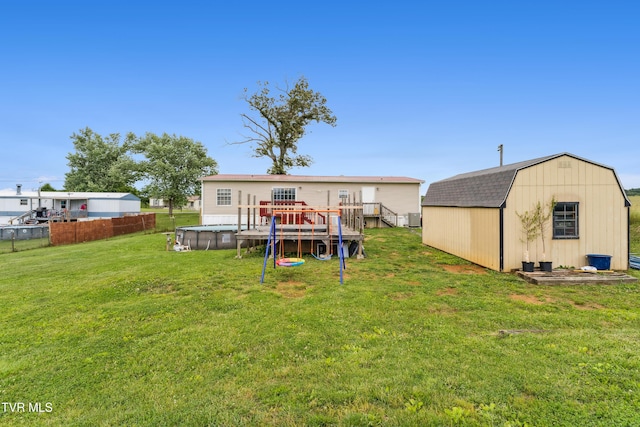 364 Berry Ridge Rd, Jonesborough, TN 37659 - rear view of house with an outdoor pool, a gambrel roof, and a deck
