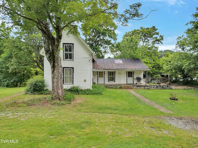 1275 Chuckey Pike, Chuckey, TN 37641 - view of front of home with a front lawn, metal roof, and covered porch