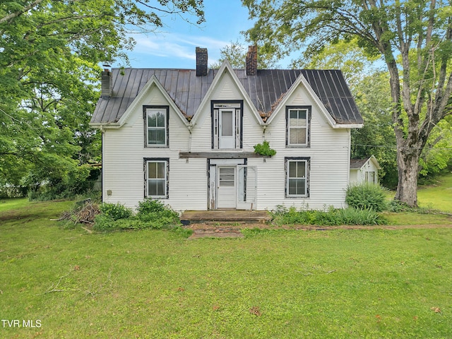 1275 Chuckey Pike, Chuckey, TN 37641 - view of front facade featuring a chimney, a front lawn, a standing seam roof, and metal roof