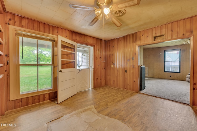 1275 Chuckey Pike, Chuckey, TN 37641 - spare room featuring a ceiling fan, wood walls, and wood finished floors