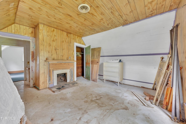 1275 Chuckey Pike, Chuckey, TN 37641 - unfurnished living room with wood ceiling, wood walls, unfinished concrete flooring, and a fireplace