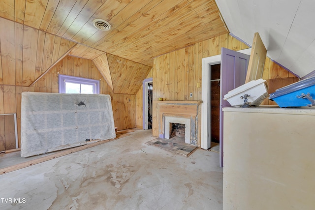 1275 Chuckey Pike, Chuckey, TN 37641 - unfurnished living room featuring lofted ceiling, wooden walls, a fireplace, and wood ceiling