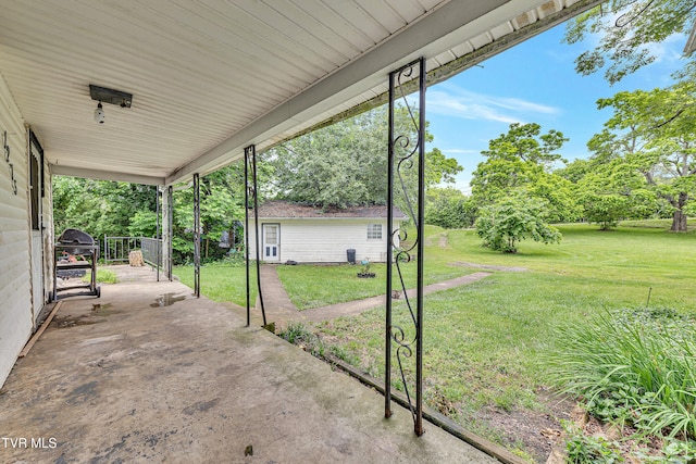 1275 Chuckey Pike, Chuckey, TN 37641 - view of patio / terrace featuring a carport, view of scattered trees, and area for grilling