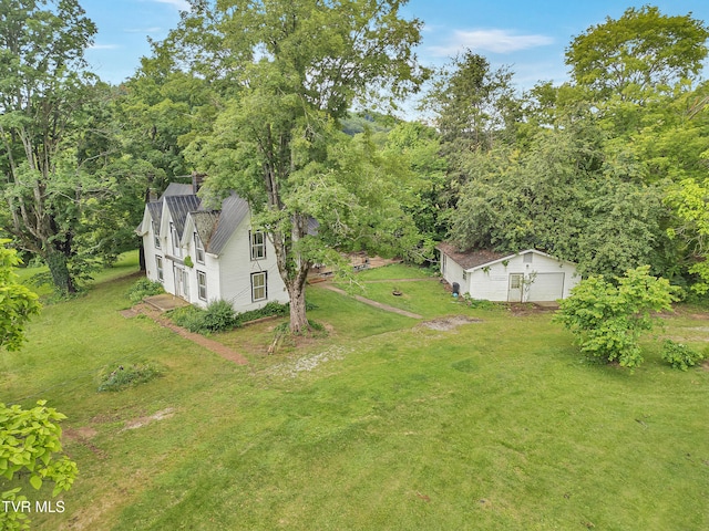 1275 Chuckey Pike, Chuckey, TN 37641 - view of green lawn featuring an outdoor structure and a detached garage