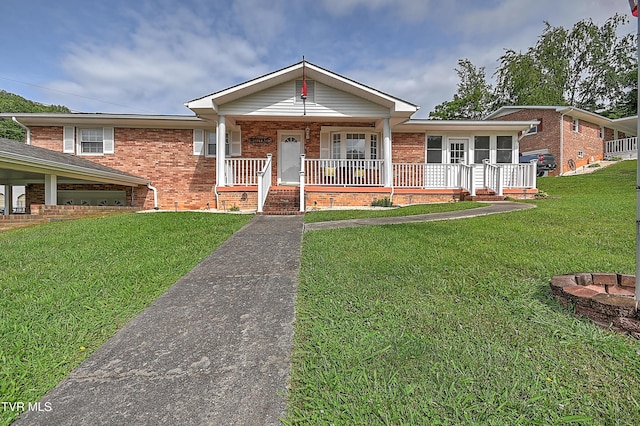 205 Live Oak Dr, Kingsport, TN 37660 - ranch-style house with brick siding, a front lawn, and covered porch
