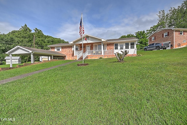 205 Live Oak Dr, Kingsport, TN 37660 - ranch-style home with a porch, a front lawn, a detached carport, and brick siding