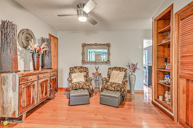 205 Live Oak Dr, Kingsport, TN 37660 - sitting room featuring wood finished floors, built in features, ceiling fan, and baseboards
