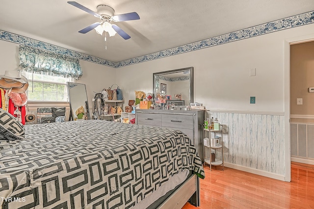205 Live Oak Dr, Kingsport, TN 37660 - bedroom with wood finished floors, a wainscoted wall, and ceiling fan