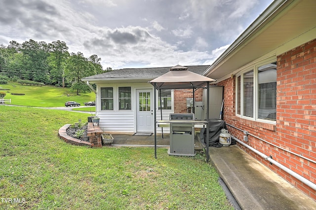 205 Live Oak Dr, Kingsport, TN 37660 - exterior space with a gazebo, a lawn, a patio, and brick siding