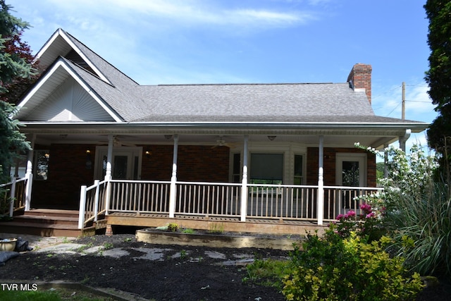 290 Kinchloe Mill Rd, Jonesborough, TN 37659 - farmhouse inspired home with a chimney, a porch, a shingled roof, and brick siding