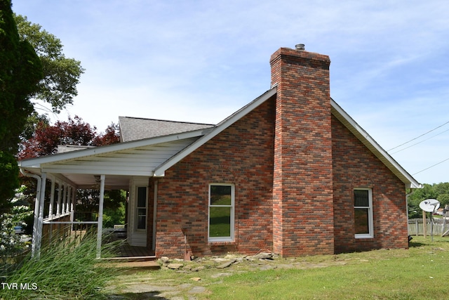 290 Kinchloe Mill Rd, Jonesborough, TN 37659 - rear view of house featuring a chimney, brick siding, and a lawn