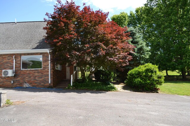 290 Kinchloe Mill Rd, Jonesborough, TN 37659 - view of front of house with brick siding, a shingled roof, and ac unit