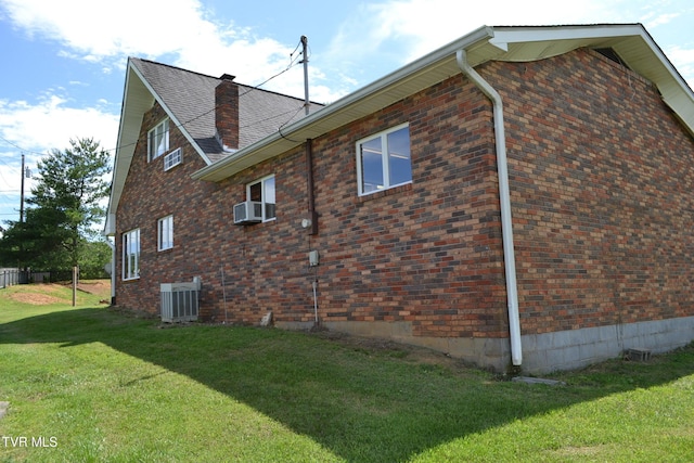 290 Kinchloe Mill Rd, Jonesborough, TN 37659 - view of side of property featuring central AC unit, a lawn, brick siding, a chimney, and cooling unit