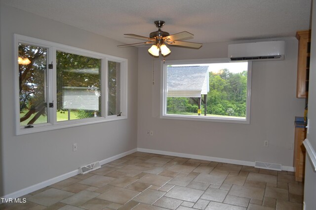 290 Kinchloe Mill Rd, Jonesborough, TN 37659 - unfurnished dining area with an AC wall unit, a ceiling fan, baseboards, and light stone finish flooring