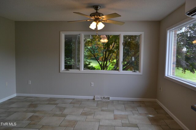 290 Kinchloe Mill Rd, Jonesborough, TN 37659 - unfurnished room with ceiling fan, baseboards, and a wall mounted air conditioner