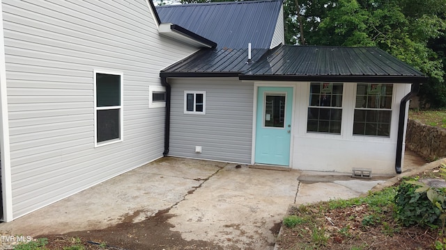 616 6th St, Bristol, TN 37620 - rear view of house with a patio and metal roof