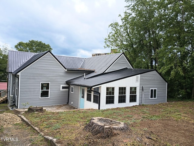 616 6th St, Bristol, TN 37620 - rear view of house with metal roof