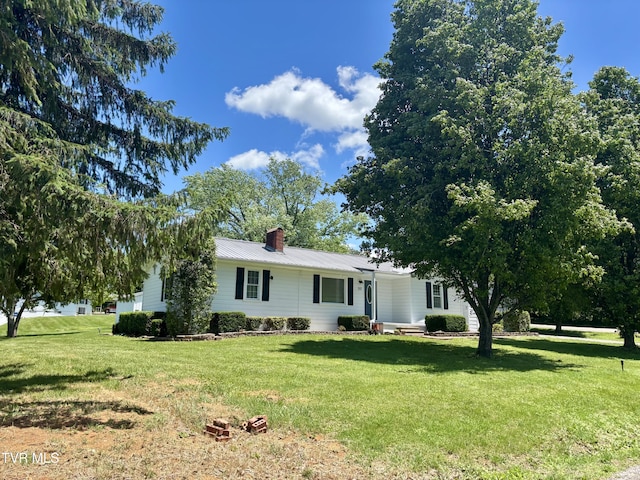 357 Martin St, Jonesville, VA 24263 - single story home with a front yard, a chimney, and metal roof