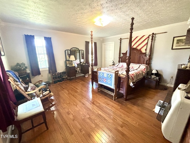 357 Martin St, Jonesville, VA 24263 - bedroom with wood finished floors, ornamental molding, and a textured ceiling