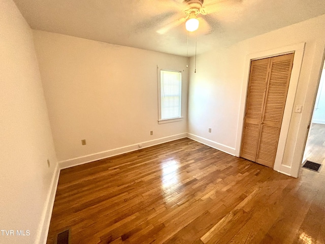 357 Martin St, Jonesville, VA 24263 - unfurnished bedroom featuring dark wood finished floors, baseboards, a closet, and ceiling fan