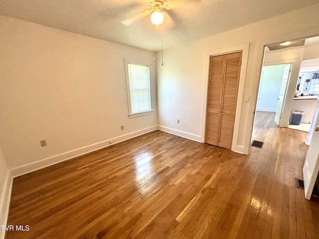 357 Martin St, Jonesville, VA 24263 - unfurnished bedroom with wood finished floors, baseboards, a closet, and ceiling fan
