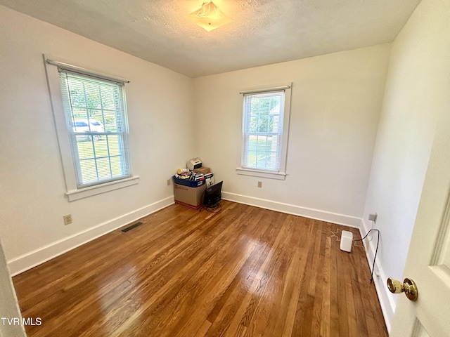 357 Martin St, Jonesville, VA 24263 - empty room featuring wood finished floors, baseboards, and a textured ceiling