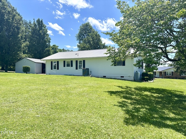 357 Martin St, Jonesville, VA 24263 - rear view of property featuring cooling unit, crawl space, a yard, and metal roof