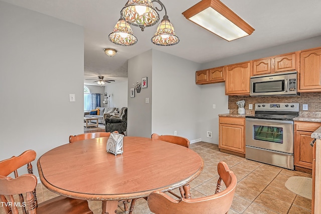 220 Amanda Ln Unit 2, Bristol, TN 37620 - kitchen with stainless steel appliances, tasteful backsplash, light countertops, light tile patterned floors, and ceiling fan