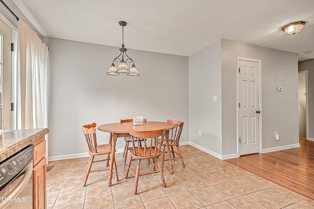 220 Amanda Ln Unit 2, Bristol, TN 37620 - dining room featuring a chandelier, light tile patterned flooring, and baseboards