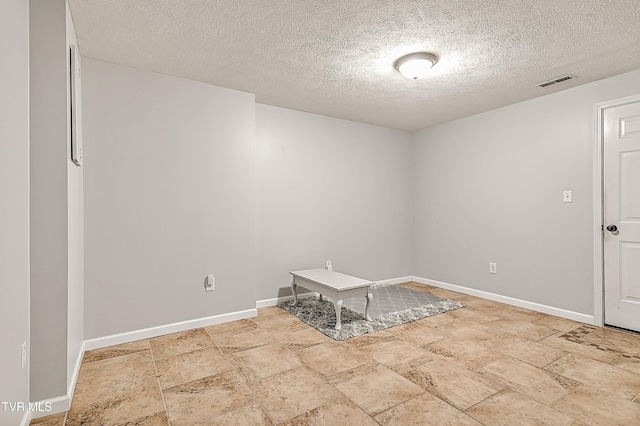 220 Amanda Ln Unit 2, Bristol, TN 37620 - spare room featuring a textured ceiling, baseboards, and stone finish floors
