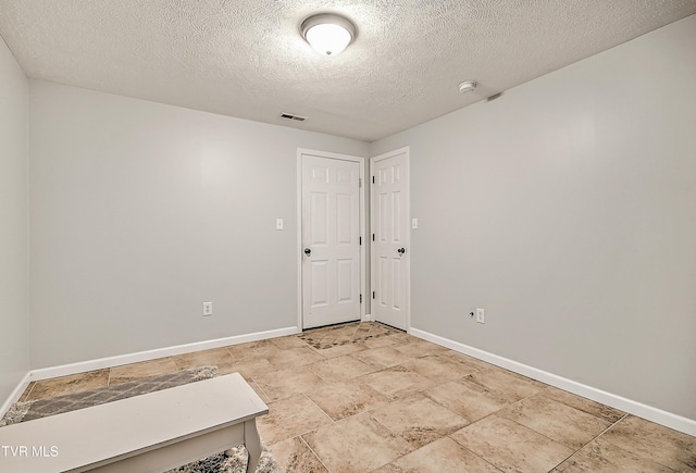 220 Amanda Ln Unit 2, Bristol, TN 37620 - spare room with baseboards, a textured ceiling, and a smoke detector