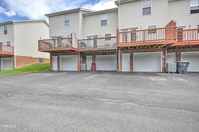 220 Amanda Ln Unit 2, Bristol, TN 37620 - rear view of house with an attached garage, driveway, and central AC unit