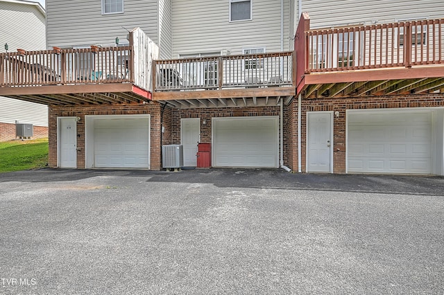 220 Amanda Ln Unit 2, Bristol, TN 37620 - back of property featuring a garage, driveway, and central AC unit