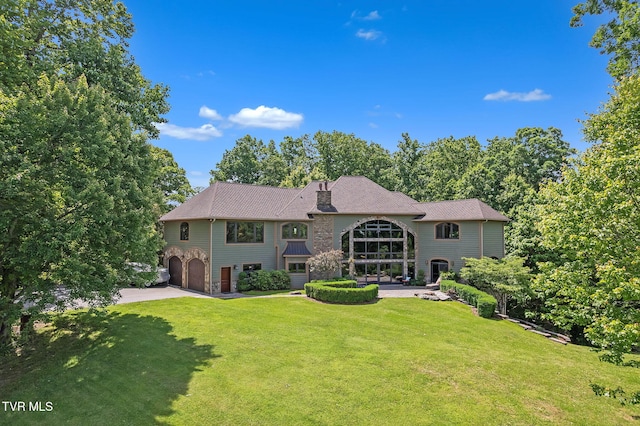 18549 Landridge Way, Abingdon, VA 24211 - back of property with a garage, a lawn, and a chimney