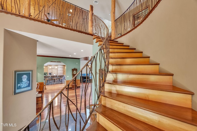 18549 Landridge Way, Abingdon, VA 24211 - staircase with arched walkways, wood finished floors, and a high ceiling