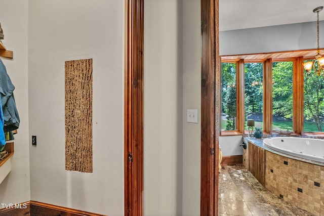 18549 Landridge Way, Abingdon, VA 24211 - full bathroom featuring a tub with jets, plenty of natural light, a chandelier, and baseboards