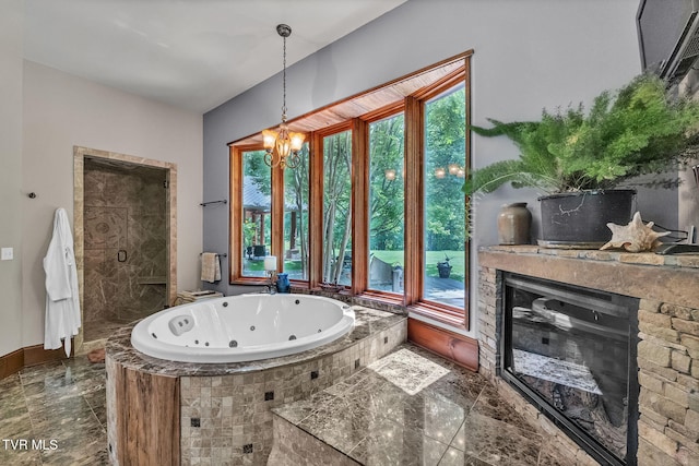 18549 Landridge Way, Abingdon, VA 24211 - full bath featuring a jetted tub, a glass covered fireplace, a chandelier, and baseboards