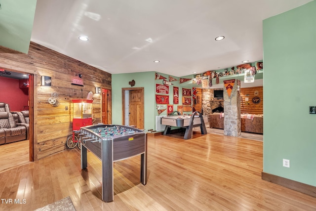 18549 Landridge Way, Abingdon, VA 24211 - playroom featuring wooden walls, wood finished floors, a fireplace, recessed lighting, and an accent wall
