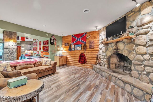 18549 Landridge Way, Abingdon, VA 24211 - living area featuring rustic walls, wood finished floors, and a fireplace