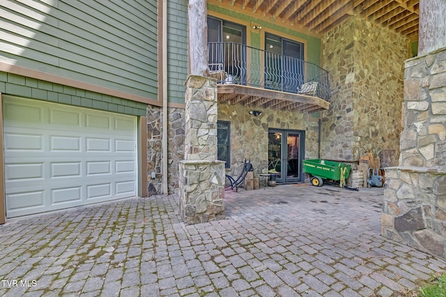 18549 Landridge Way, Abingdon, VA 24211 - view of patio featuring a balcony, a garage, and decorative driveway
