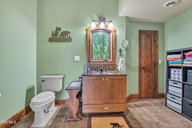 18549 Landridge Way, Abingdon, VA 24211 - bathroom featuring vanity, toilet, backsplash, and baseboards