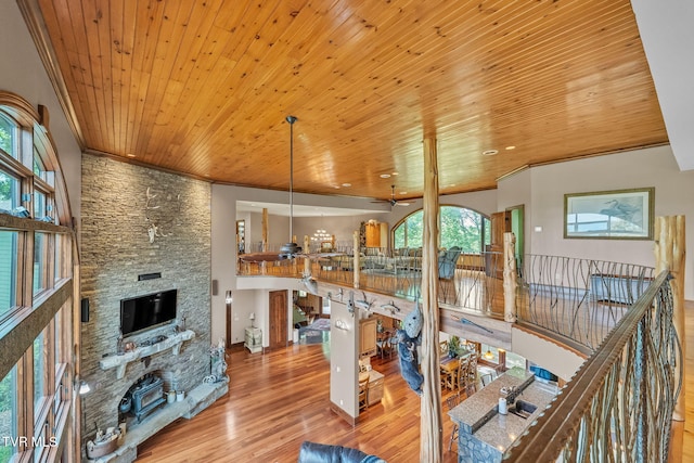18549 Landridge Way, Abingdon, VA 24211 - living room with wood ceiling, wood finished floors, a stone fireplace, crown molding, and ceiling fan