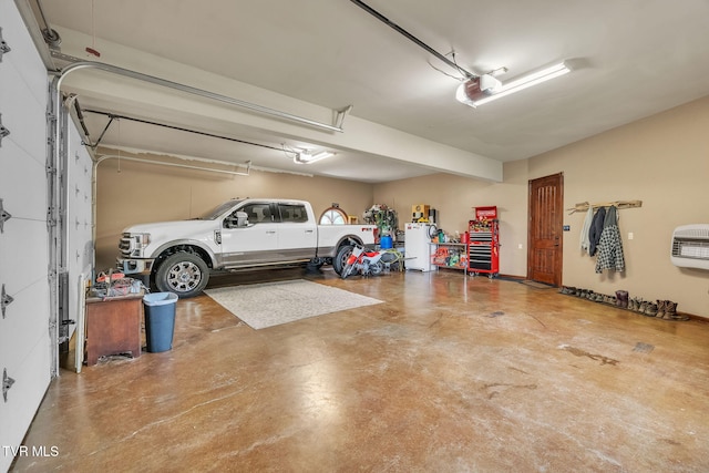 18549 Landridge Way, Abingdon, VA 24211 - garage featuring freestanding refrigerator, heating unit, and a garage door opener